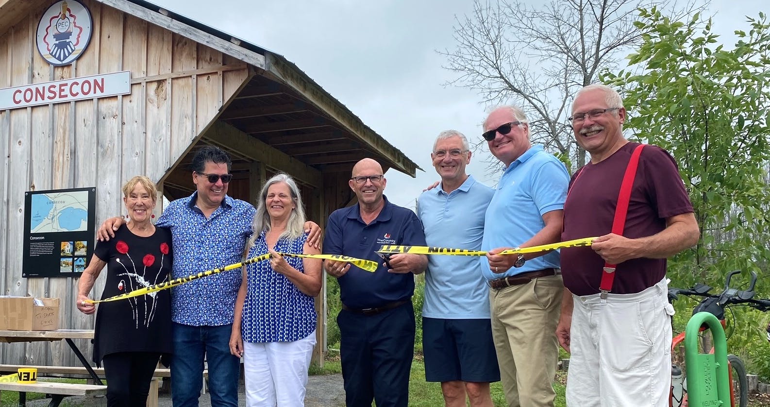 <p>The Millennium Trail rest stop at Salem Road was officially opened last week. Attending the ribbon cutting (From left) was principal materials donor Bev Skidmore, Ameliasburgh councillors Sam Grosso and Janice Maynard, Mayor Steve Ferguson, PEC Trails Committee Chair Gregor Stuart, Hillier councillor Chris Braney and Picton councillor Phil St. Jean. (Supplied Photo)</p>
